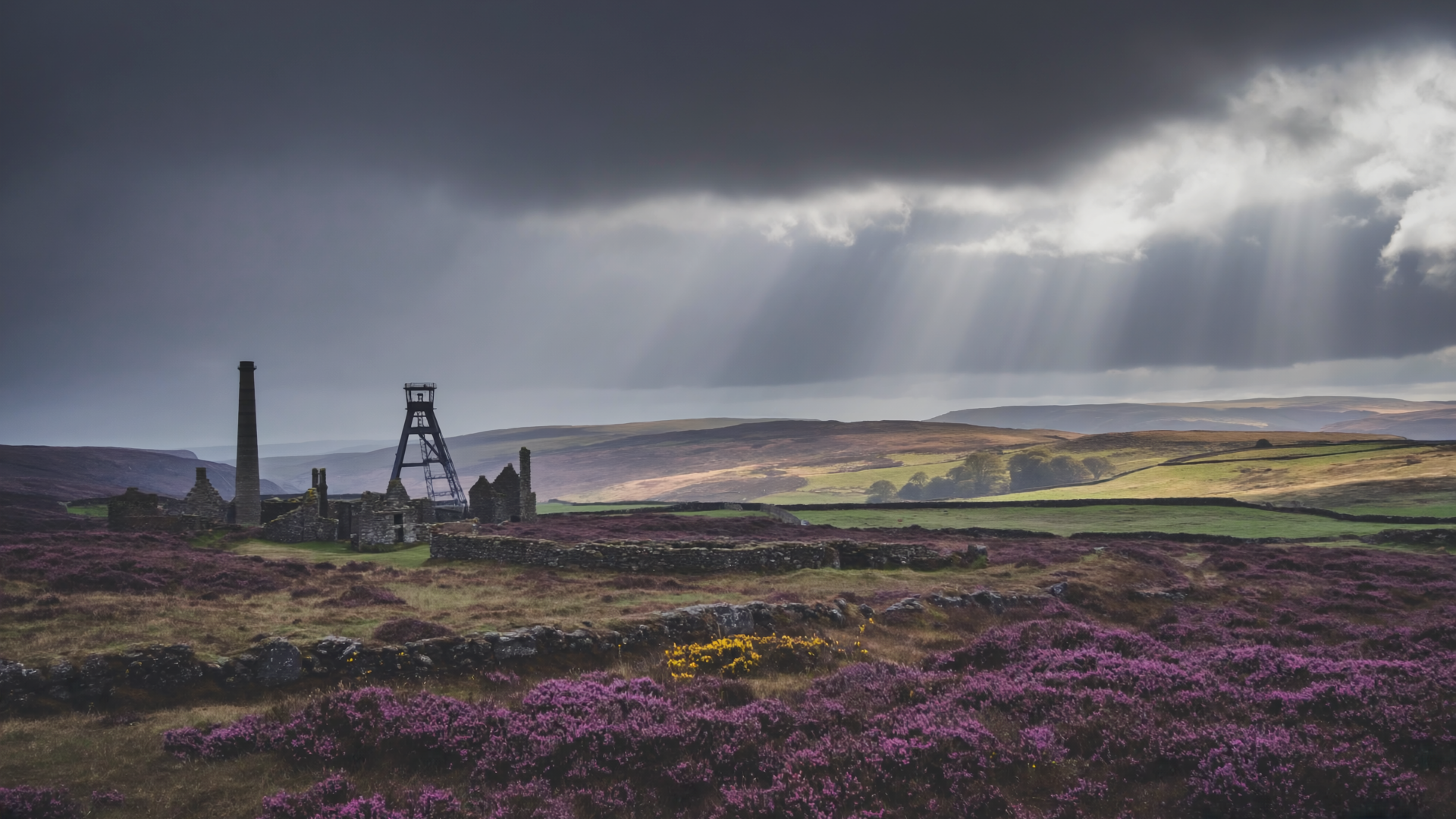 Dramatic Cornish moorland with stormy sky and mining chimney in distance