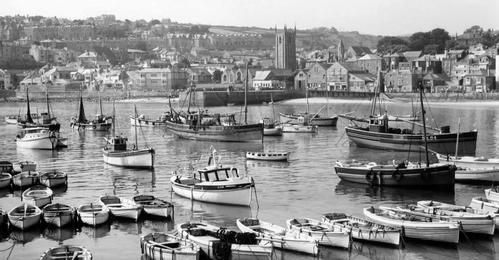 Historic St Ives harbour filled with fishing boats